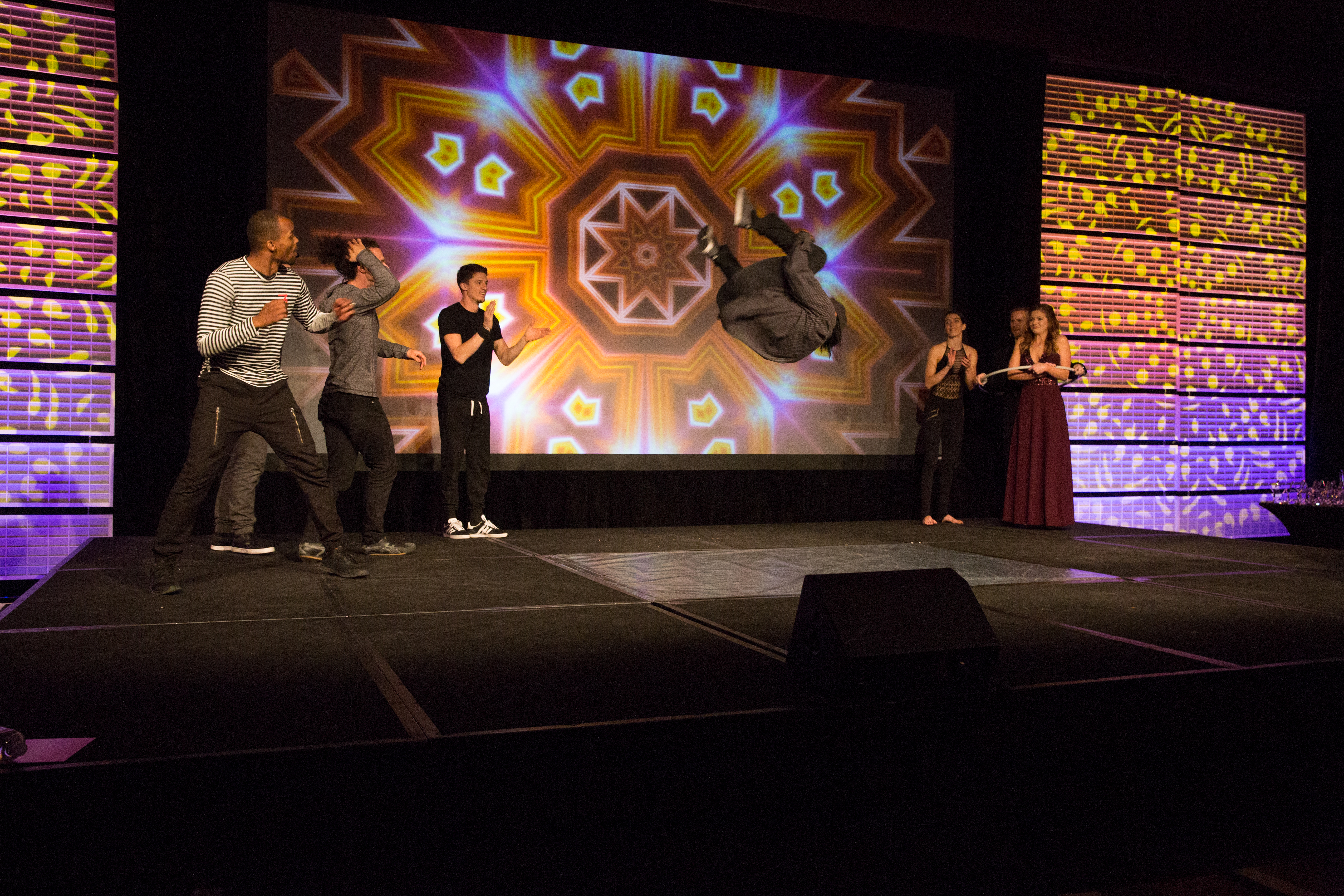The Sacred G's dancing on stage.