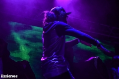 The Sacred G's dancing on stage.